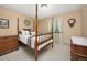 Cozy bedroom featuring a four-poster bed and a neutral color scheme at 2871 Humboldt Cir, Longmont, CO 80503