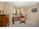 Comfortable bedroom with a wooden desk, chair, and a window with natural light at 2871 Humboldt Cir, Longmont, CO 80503