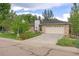 Charming single-Gathering home with a well-manicured lawn, mature trees, and an attached two-car garage at 2871 Humboldt Cir, Longmont, CO 80503