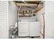 Laundry room with washer, dryer, and storage shelves at 2871 Humboldt Cir, Longmont, CO 80503