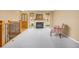 Bright living room featuring a stone fireplace, large windows, and neutral carpet at 2871 Humboldt Cir, Longmont, CO 80503