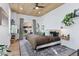 Cozy bedroom with hardwood floors, a backyard view, and a decorative ceiling, creating a relaxing retreat at 701 W 6Th Ave, Denver, CO 80204