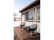 Charming deck space, featuring rocking chairs, a small table, and views of the neighborhood at 701 W 6Th Ave, Denver, CO 80204
