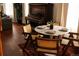 Bright dining area with a round table, hardwood floors, and a glimpse of the living space at 701 W 6Th Ave, Denver, CO 80204
