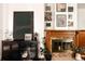 Fireplace with brick surround, decorative wood trim and modern black storage at 701 W 6Th Ave, Denver, CO 80204