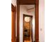 Hallway with wood trim and a view into an adjacent room at 701 W 6Th Ave, Denver, CO 80204