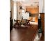 Modern kitchen featuring light wood cabinets and stainless steel appliances with adjacent dining area at 701 W 6Th Ave, Denver, CO 80204