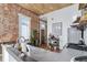 Contemporary kitchen with updated countertops, exposed brick wall, and wooden accents at 701 W 6Th Ave, Denver, CO 80204