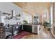 Modern kitchen features stainless steel appliances, wood floors, and exposed brick, creating a modern urban space at 701 W 6Th Ave, Denver, CO 80204