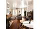 Bright living room featuring hardwood floors, fireplace, and large windows with sheer curtains at 701 W 6Th Ave, Denver, CO 80204