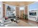 Inviting living room boasts lots of natural light, exposed brick and a wood ceiling at 701 W 6Th Ave, Denver, CO 80204