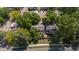 Aerial view of home surrounded by mature trees in a well-maintained neighborhood at 8060 Meadowdale Sq, Niwot, CO 80503