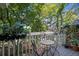 Relaxing balcony area with seating surrounded by lush greenery at 8060 Meadowdale Sq, Niwot, CO 80503
