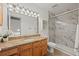 Updated bathroom features a granite countertop and glass-enclosed, marble-tiled shower at 8060 Meadowdale Sq, Niwot, CO 80503