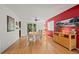 Bright dining area with hardwood floors and a large window overlooking the backyard at 8060 Meadowdale Sq, Niwot, CO 80503