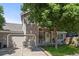 Charming two-story home with a well-maintained front yard, an attached garage, and mature shade trees at 8060 Meadowdale Sq, Niwot, CO 80503