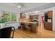 Kitchen featuring stainless steel appliances, tile backsplash, granite countertops, and an island at 8060 Meadowdale Sq, Niwot, CO 80503
