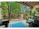 Large backyard patio with outdoor furniture, decor, and mature trees at 8060 Meadowdale Sq, Niwot, CO 80503
