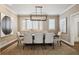 Elegant dining room showcasing a modern chandelier, neutral decor, and large windows at 2500 S Clayton St, Denver, CO 80210