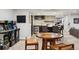 This fun game room features an arcade game, bar with seating, and stylish decor for entertainment at 2500 S Clayton St, Denver, CO 80210