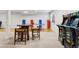 This game room is perfect for Gathering fun, featuring an arcade game and a ping pong table at 2500 S Clayton St, Denver, CO 80210
