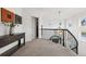 Bright second floor landing with dark wood accents, neutral colors, and modern light fixture at 2500 S Clayton St, Denver, CO 80210
