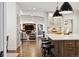 Gourmet kitchen featuring a large island and open layout into living room and dining area at 2500 S Clayton St, Denver, CO 80210
