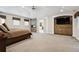 Spacious main bedroom suite with stone fireplace, tv cabinet, and neutral colors at 2500 S Clayton St, Denver, CO 80210