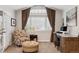 Bright office with large window, patterned curtains, and comfortable seating area at 2500 S Clayton St, Denver, CO 80210