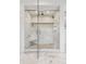 Luxurious walk-in shower with marble tile, built-in seat, and dual shower heads at 2500 S Clayton St, Denver, CO 80210