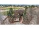 Aerial view of home surrounded by mature trees, golf course, and beautiful landscaping at 101 Glenmoor Ln, Cherry Hills Village, CO 80113