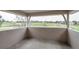Covered balcony overlooking a lush green golf course, provides outdoor enjoyment at 101 Glenmoor Ln, Cherry Hills Village, CO 80113
