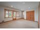 Finished basement featuring neutral carpet, recessed lighting, windows, and natural wood trim and doors at 101 Glenmoor Ln, Cherry Hills Village, CO 80113
