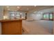 Large finished basement featuring a wet bar, carpet flooring, and recessed lighting for a comfortable space at 101 Glenmoor Ln, Cherry Hills Village, CO 80113