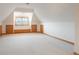 Attic bonus room with bright windows and a unique vaulted ceiling at 101 Glenmoor Ln, Cherry Hills Village, CO 80113