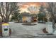 Elegant home with a circular driveway, manicured landscaping, and brick accents creating a welcoming curb appeal at 101 Glenmoor Ln, Cherry Hills Village, CO 80113