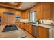 Modern kitchen featuring stainless appliances, granite countertops, and wood cabinetry with tiled backsplash at 101 Glenmoor Ln, Cherry Hills Village, CO 80113
