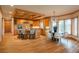 Spacious kitchen features an island with bar seating and modern appliances with an open dining area at 101 Glenmoor Ln, Cherry Hills Village, CO 80113