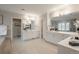 Elegant main bathroom with dual vanities, large mirrors, and stylish fixtures at 101 Glenmoor Ln, Cherry Hills Village, CO 80113