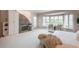 Spacious main bedroom with fireplace, sitting area with bay window, and plush carpeting at 101 Glenmoor Ln, Cherry Hills Village, CO 80113