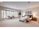 Spacious main bedroom featuring sitting area with bay window, neutral tones, and plush carpeting at 101 Glenmoor Ln, Cherry Hills Village, CO 80113
