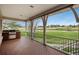 Covered patio with a built-in grill offering serene views of a well-manicured lawn and open sky at 101 Glenmoor Ln, Cherry Hills Village, CO 80113