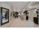 This fully finished basement features a kitchenette, billiards, and a wine cellar behind a decorative glass door at 1366 Killington Ct, Evergreen, CO 80439