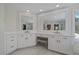 Bright bathroom featuring double vanity, ample cabinet space, and elegant white marble flooring at 1366 Killington Ct, Evergreen, CO 80439