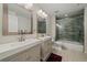 This Primary bathroom includes double sinks, an updated shower, and modern finishes at 1366 Killington Ct, Evergreen, CO 80439