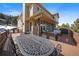 Expansive outdoor deck featuring a wrought-iron dining table and stylish wicker seating, perfect for entertaining at 1366 Killington Ct, Evergreen, CO 80439