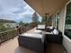Expansive deck with ample seating, offering stunning views of the surrounding landscape at 1366 Killington Ct, Evergreen, CO 80439