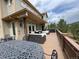 Large outdoor deck perfect for entertaining, complete with dining and lounge areas at 1366 Killington Ct, Evergreen, CO 80439