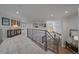 Open hallway with a carpet floor and beautiful views of the home and great natural lighting at 1366 Killington Ct, Evergreen, CO 80439