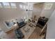 Bright living room with stone fireplace, high ceilings and beautiful natural light at 1366 Killington Ct, Evergreen, CO 80439
